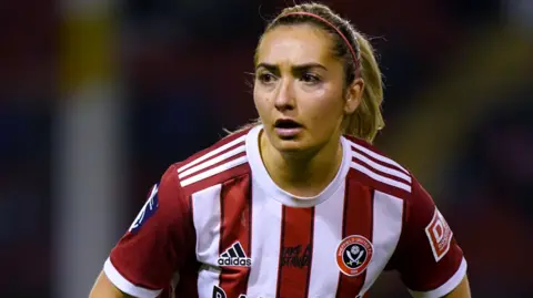 PA Media Maddy Cusack playing for Sheffield United