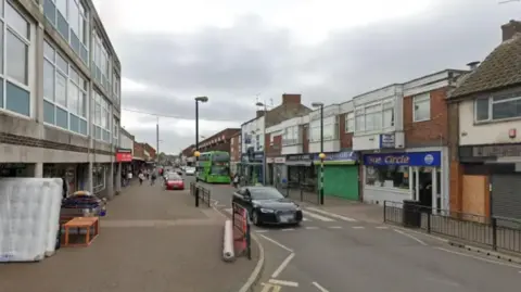 Google A town centre street with a zebra crossing