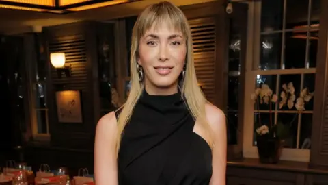 Getty Images Paris Lees pictured in 2022, wearing a black dress