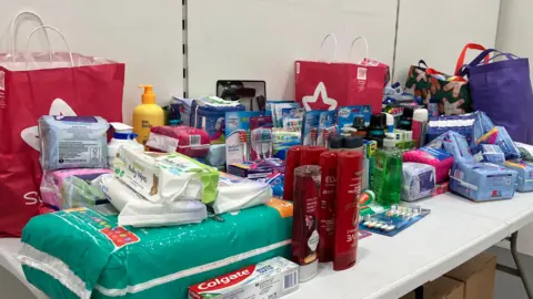 Jon Wright/BBC A collection of toiletries on a table