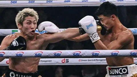 Naoya Inoue lands a punch on Junto Nakatani