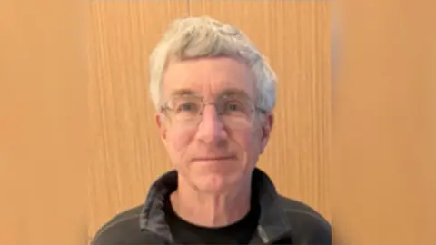 Bernalillo County Sheriff's Office A photo of William, who has white hair, spectacles and a collared jacket