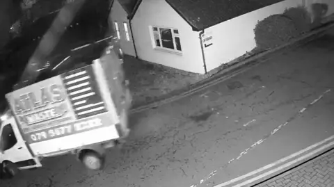 St Albans City and District Council A CCTV shot of a blurred van moving quickly along a road. It says "Atlas Waste" on the side.