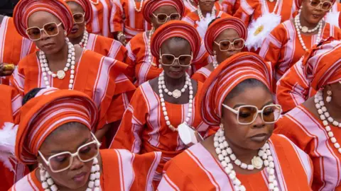Toyin Adedokun/AFP Members of the Egbe Obaneye Obinrin parade to pay homage to the King, Awuja Ile of Ijebuland, during the annual Ojude Oba festival in Ijebu Ode on June 18, 2024. Ojude Oba festival is an ancient festival celebrated by the Yoruba people of Ijebu Ode, a town in Ogun State Nigeria. This annual festival usually takes place the third day after Eid El Kabir to pay homage and show respect to the King the Awujale of Ijebuland.