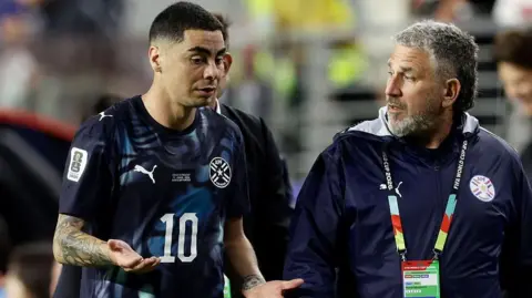 Miguel Almiron of Paraguay leaves the pitch after receiving a red card 
