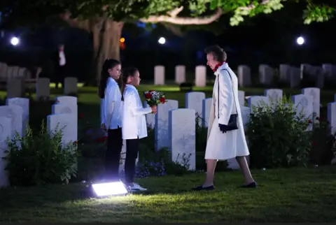 Reuters Britain's Anne, The Princess Royal, President of the Commonwealth War Graves Commission accepts a posy to lay on the Grave of an Unknown Soldier, during the Commonwealth War Graves Commission's Great Vigil