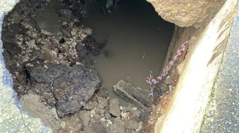 Borough Council of King’s Lynn and West Norfolk A view of stones and larger pieces of rock under the promenade at Hunstanton. The area should be solid rock but it has been eroded by the sea. 