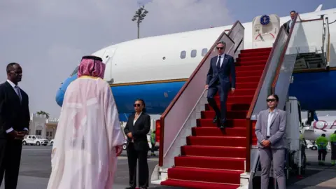 Getty Images US Secretary of State Antony Blinken gets off the plane and walks down the stairs upon arriving in Doha during a recent visit to Qatar