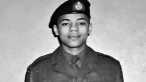 Supplied A young man looking proud in his Royal Marine uniform and beret in a black and white picture