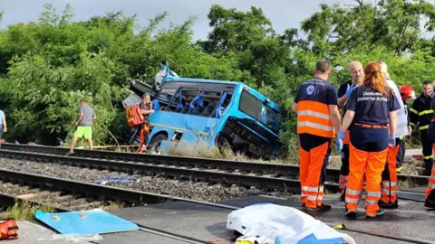 Reuters Emergency personnel work at the site of the collision