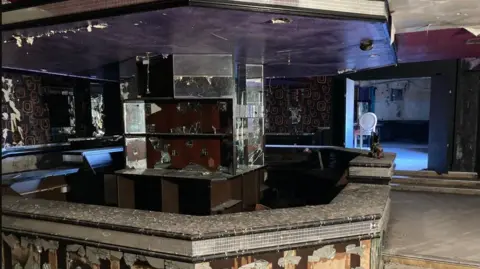 LDRS One of the bars at the former Castleford Picture House nightclub. Lots of broken mirrors, ripped wallpaper and bird poo on the bar 