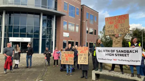 Protestors from Sandbach outside Cheshire East Council's headquarters