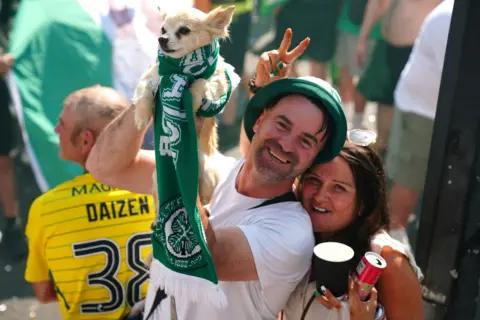 PA Media Some fans brought their pets along for the celebrations to mark Celtic's 55th league title