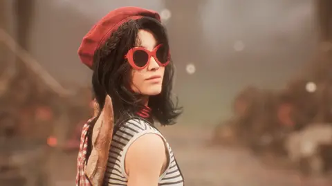 A screenshot from Clair Obscur shows a character with shoulder-length dark hair looking back over her shoulder at the viewer. She wears a red beret, large, red-rimmed sunglasses and a white tank top with thin grey stripes. A knapsack with a baguette poking out of it is slung over her shoulder.