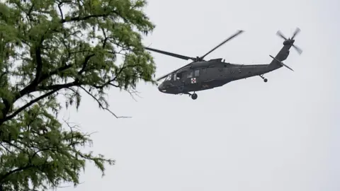 Getty Images A UH-60 Black Hawk helicopter conducts rescue operations along the Guadalupe River on July 4, 2025