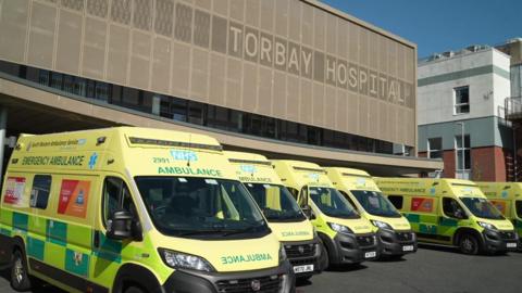 Torbay Hospital with ambulances out front 