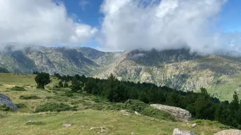 Family handout Rolling valleys, forests and clouds seen on the Pyrenees