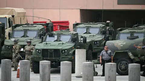 California National Guard troops and vehicles deployed to Los Angeles on Sunday in the wake of protests against federal immigration raids.