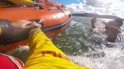 RNLI RNLI crew rescue Mr Hodson and boy