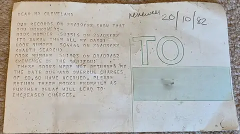 A picture of a letter which is detailing a number of library book fines.