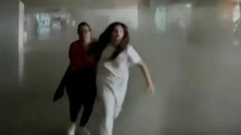 People run from earthquake hit building 
