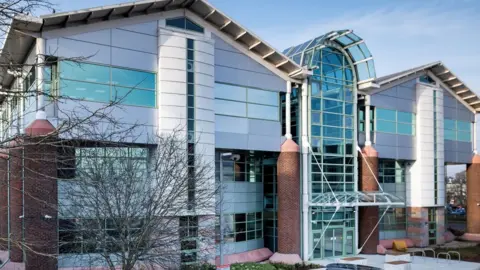 A modern glass building of where Reading's new police station will be in Whitley.