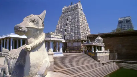 Getty Images Annamalaiyar Temple is a Hindu temple dedicated to the god Shiva. The present structure was built during the Chola dynasty in the 9th Century, while later expansions are attributed to Vijayanagar rulers of the Sangama Dynasty (1336-1485 CE), the Saluva Dynasty and the Tuluva Dynasty (1491-1570 CE).