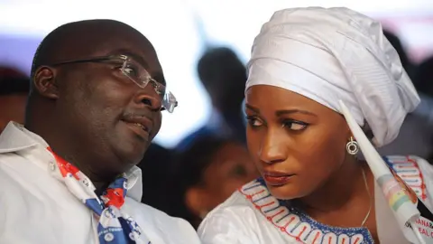 AFP Mahamudu Bawumia talks to his wife Samira at a campaign meeting