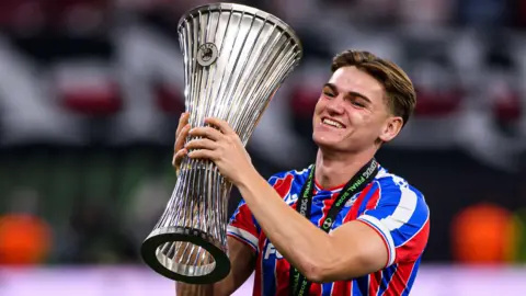Justin Devenny with the Uefa Conference League trophy