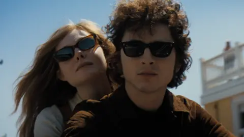 Searchlight Pictures Timothée Chalamet and Elle Fanning in Bob Dylan biopic A Complete Unknown