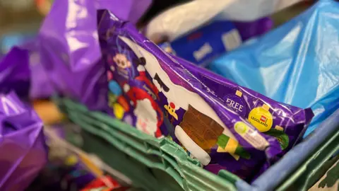 Shaun Whitmore/BBC Chocolates in a food hampers