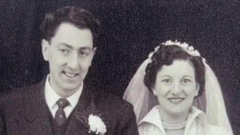 Supplied A black and white image of Ron and Nancy Ashpool on their wedding day. Mr Ashpool is wearing a suit and Mrs Ashpool a white wedding dress.