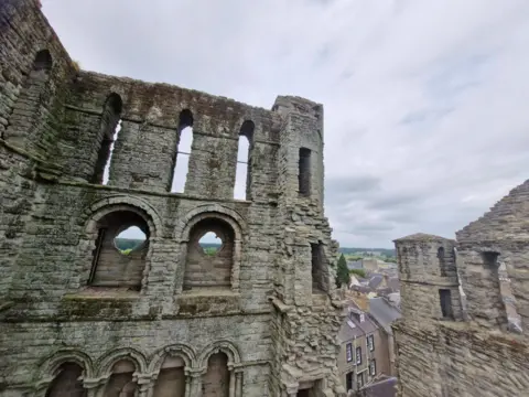 KHS A view of the walls of Kelso Abbey and out across the rooftops
