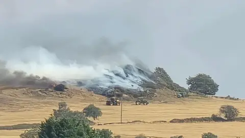 Jack Roberts Smouldering land surrounded by farm