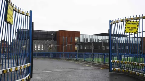 PA Media A shot of a new building from the gated entrance. 