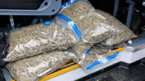 Greater Manchester Police Cannabis in vaccuum bags, in the boot of a car 