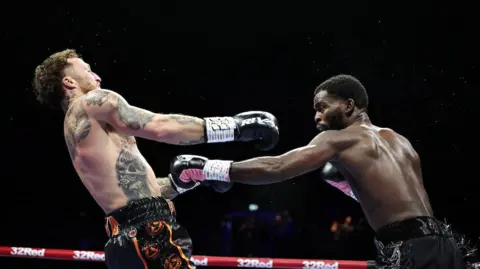 Joshua Buatsi lands a right jab at Zach Parker 