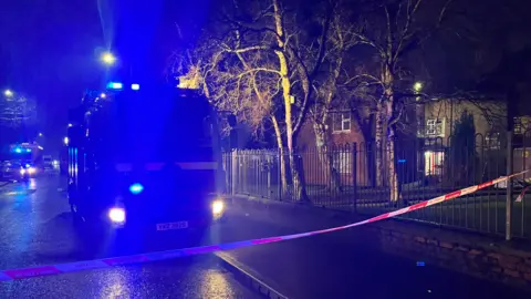 Ruth Brooks Fire appliance and tape beside railings in Sydenham in east Belfast