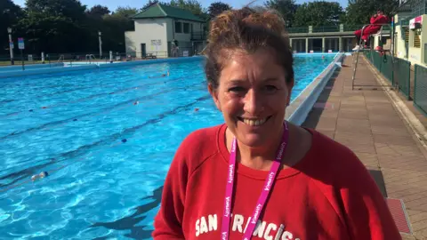 John Devine/BBC  Nina Wright stood next to the pool