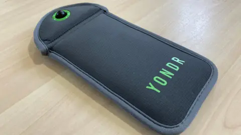 A grey Yondr pouch