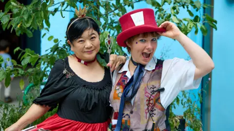 Adrian Cassidy/TheStoryMuseum People dressed up as The Queen of Hearts and The Mad Hatter from Alice in Wonderland on Alice's Day in Oxford. 