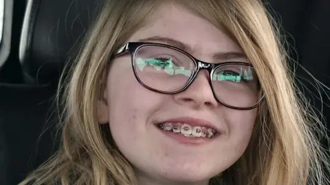 RCMP close-up of 12-year-old girl Zoey Benoit, smiling with braces