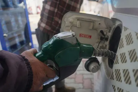 NurPhoto via Getty Images An employee fills the tank of a car with diesel at a Hindustan Petroleum (HP) fuel station in Srinagar, Jammu and Kashmir, on February 02, 2026. 