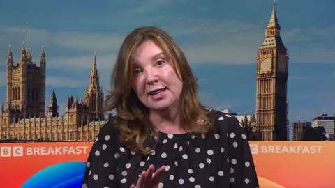 Dame Rachel de Souza wearing a polka dot top appearing on BBC Breakfast