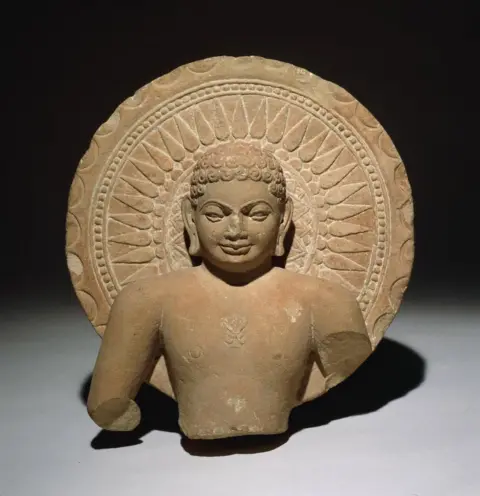 The Trustees of the British Museum Tirthankara with a halo, sandstone, India, AD 200–300.