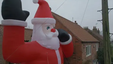 The giant santa outside the Routledge's home