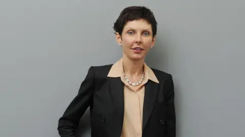 Bet365/PA Denise Coates is pictured wearing a suit and beige shirt in a company headshot