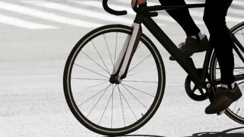 Close up image of black bicycle wheel