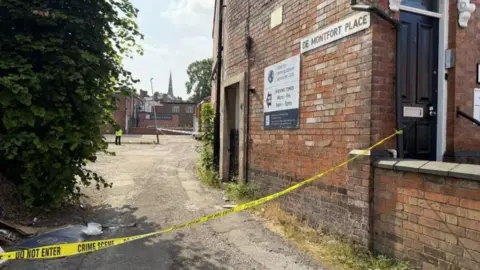 BBC Police tape cordoning off De Montfort Place in Leicester