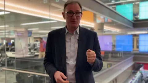 BBC Diplomatic correspondent James Landale wearing blue shirt and navy blazer